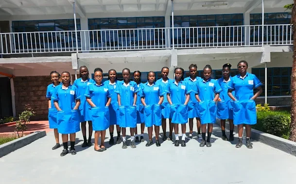 Nursing students in uniform in the campus courtyard